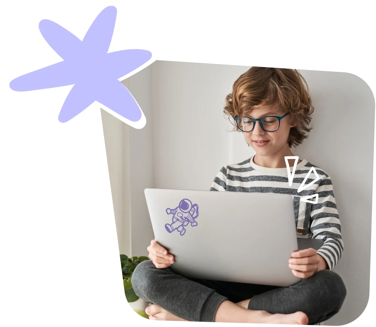 Teenage boy with glasses using a laptop for an online English lesson